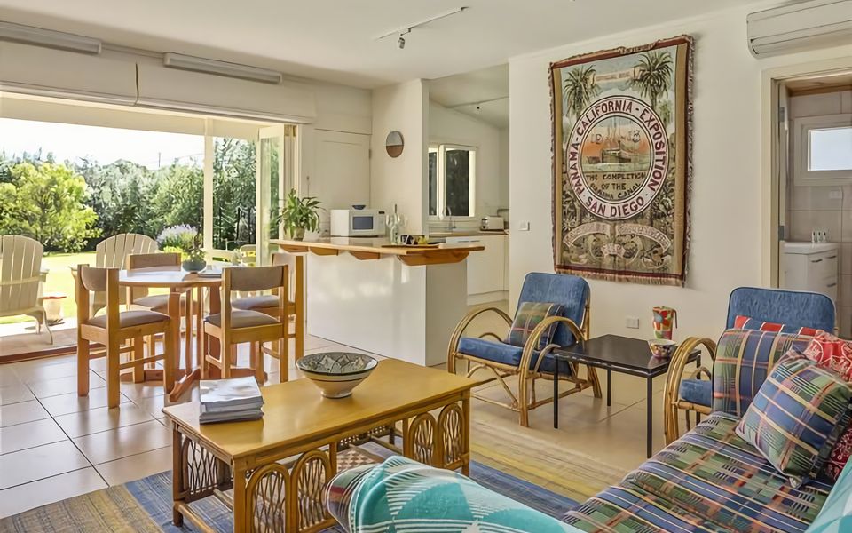 Large main living area, kitchen, dining area and bathroom.