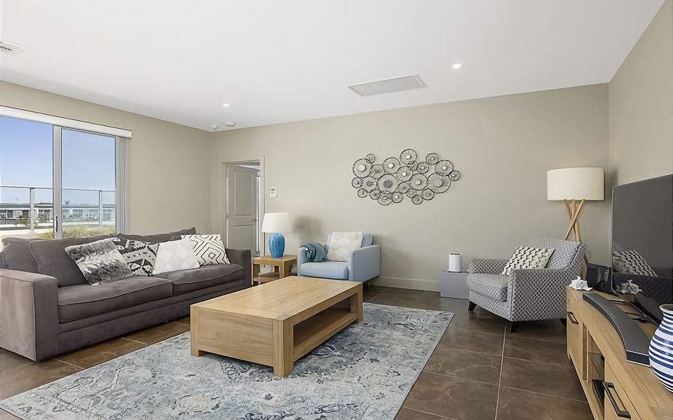 Relax and unwind in our inviting lounge area, complete with a cozy sofa and a large flat-screen TV.