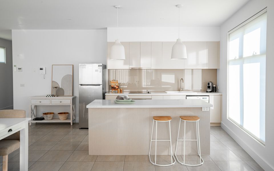 Modern kitchen with all the essentials and seating for two at the breakfast bar