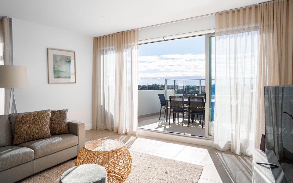 Light filled lounge area with access to your own private balcony.