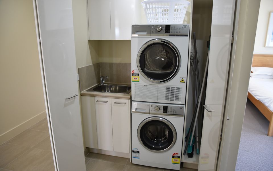 European laundry with washing machine and dryer.
