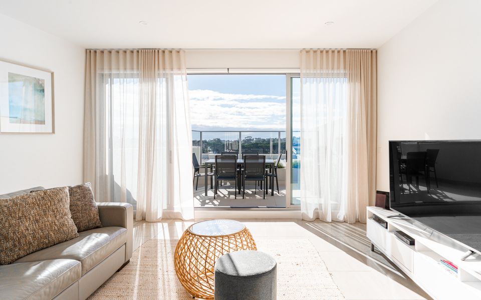 Living area with access to your private balcony with BBQ and outdoor setting