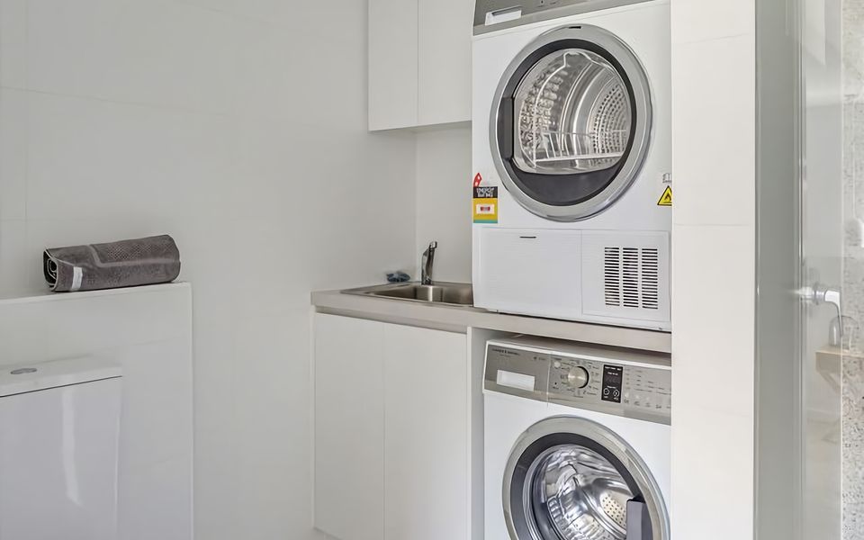 Laundry Made Easy: Stay fresh and clean with a fully equipped laundry area, including a washing machine and dryer.