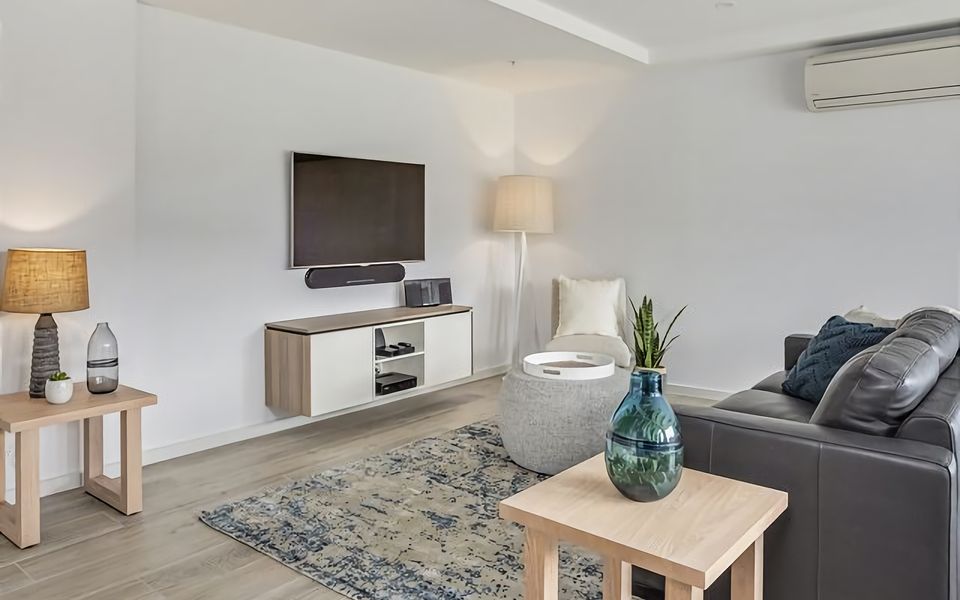 Relax and unwind in our inviting lounge area, complete with a cozy sofa and a large flat-screen TV.