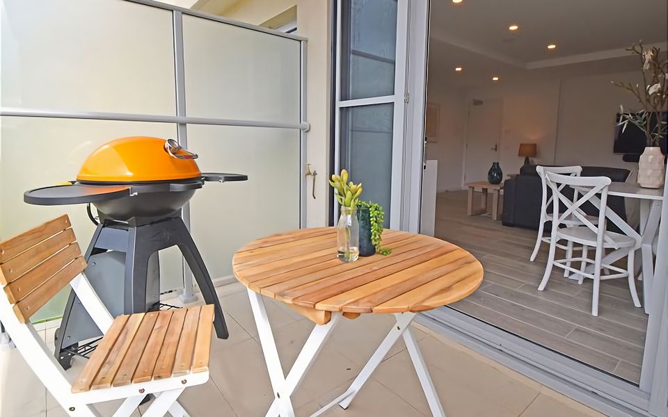 Relax and unwind on your private balcony with BBQ and outdoor setting.
