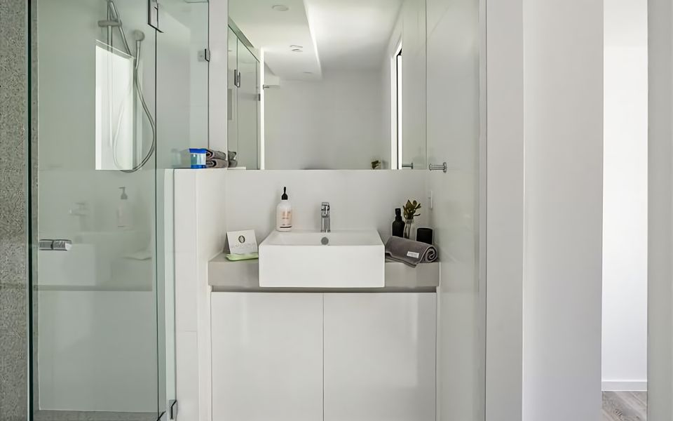 Ensuite bathroom with large shower, vanity and toilet.