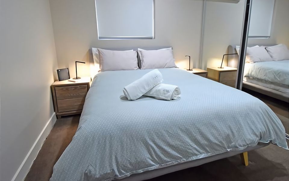 Rest and recharge in our master bedroom complete with a queen bed, designed to provide a peaceful night's sleep.