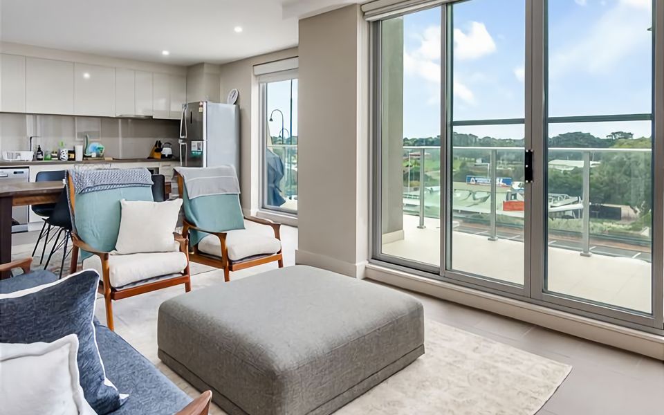 Lounge with access to sliding doors to the balcony with BBQ and views.