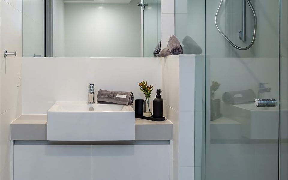 Ensuite bathroom with large shower, vanity and toilet.