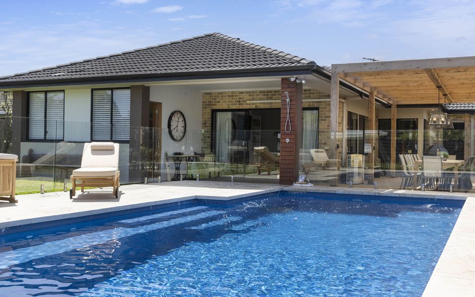 Resort style in ground solar-heated swimming pool
