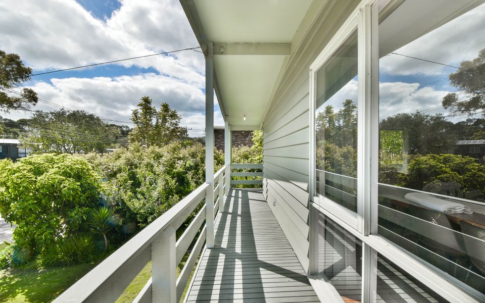 Enjoy the afternoon sun from the balcony with views over the terraced garden and lawn