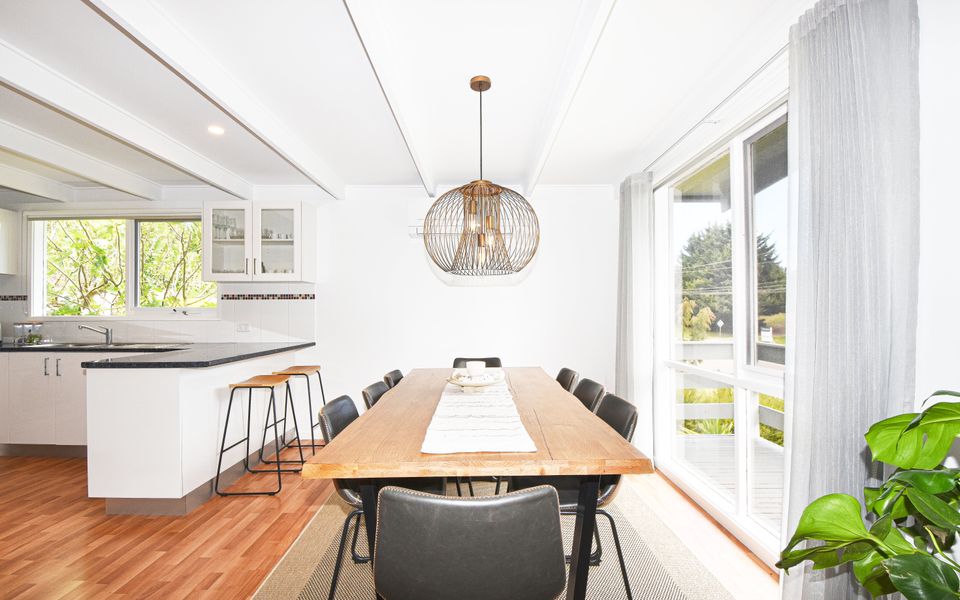 8 seat dining table beside the kitchen.
