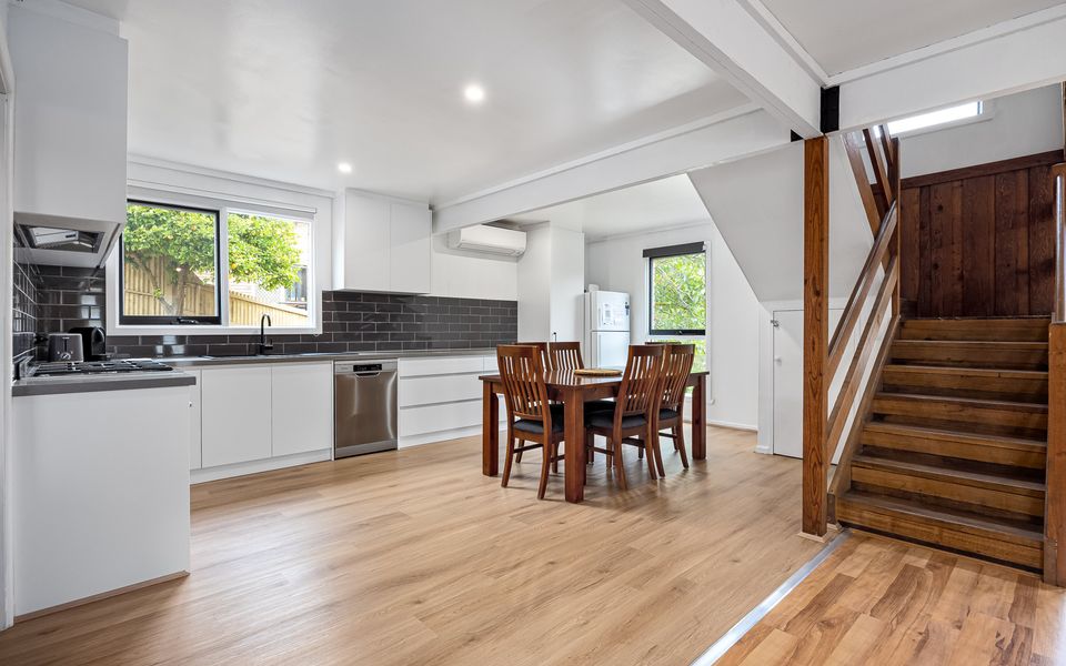 Open-concept perfection: The seamless flow between the kitchen and dining area allows for easy interaction while preparing meals and enjoying shared moments.