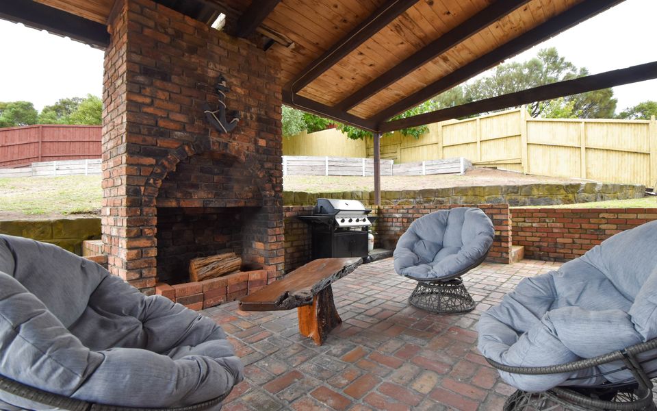 Enjoy the outdoors with fireplace and outdoor area.