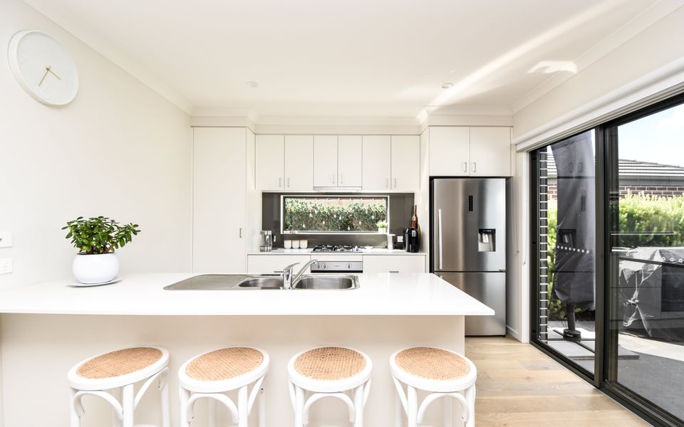 Our property's light-filled kitchen is a true gem, offering a perfect blend of style and functionality, making it a joy to prepare meals or simply unwind.