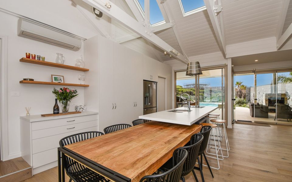 Enjoy the use of the kitchen bench extends onto a breakfast table.