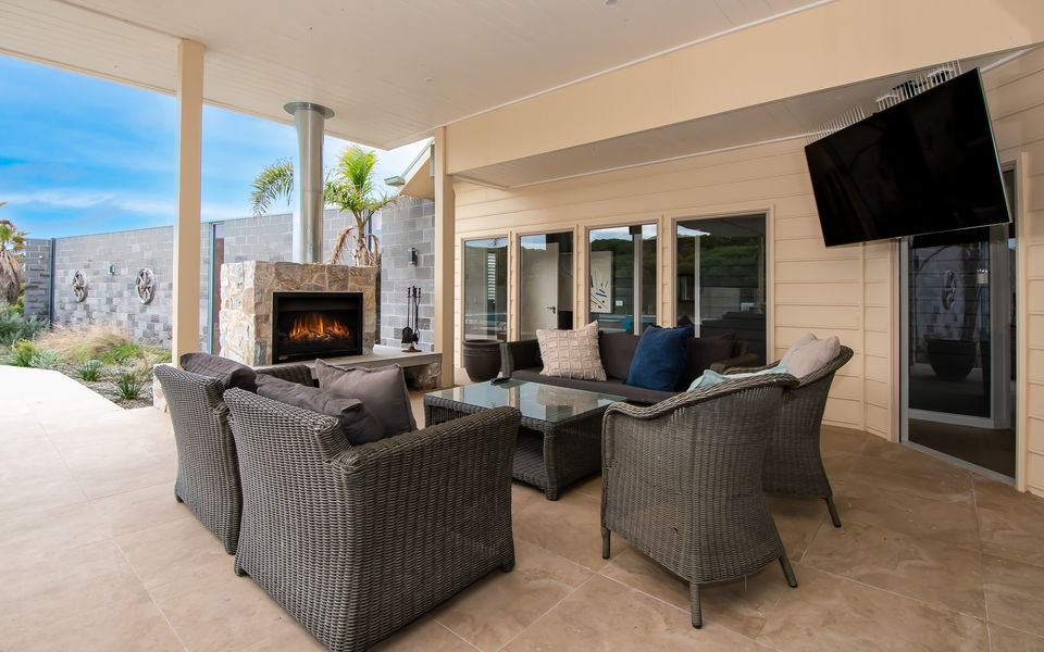 No matter the weather, enjoy a all outside has to offer with the outdoor seating and fireplace.