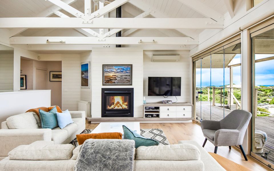 Relax in comfort in the main lounge area with a fireplace.