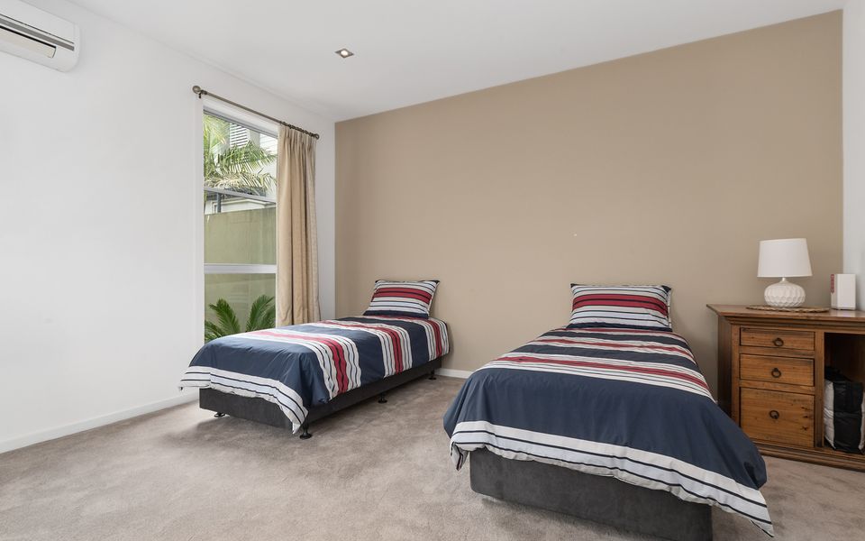 Bedroom on ground floor with two single beds and a trundle