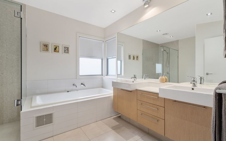 Master ensuite with spa bath, double vanity and separate shower