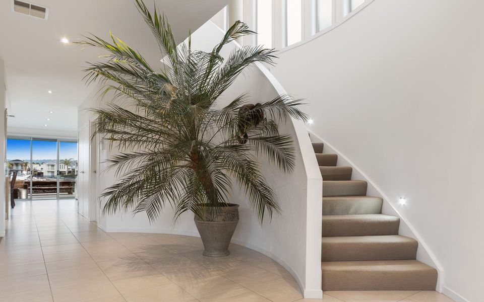 This staircase leads to the mezzanine, connecting the first-floor bedrooms.