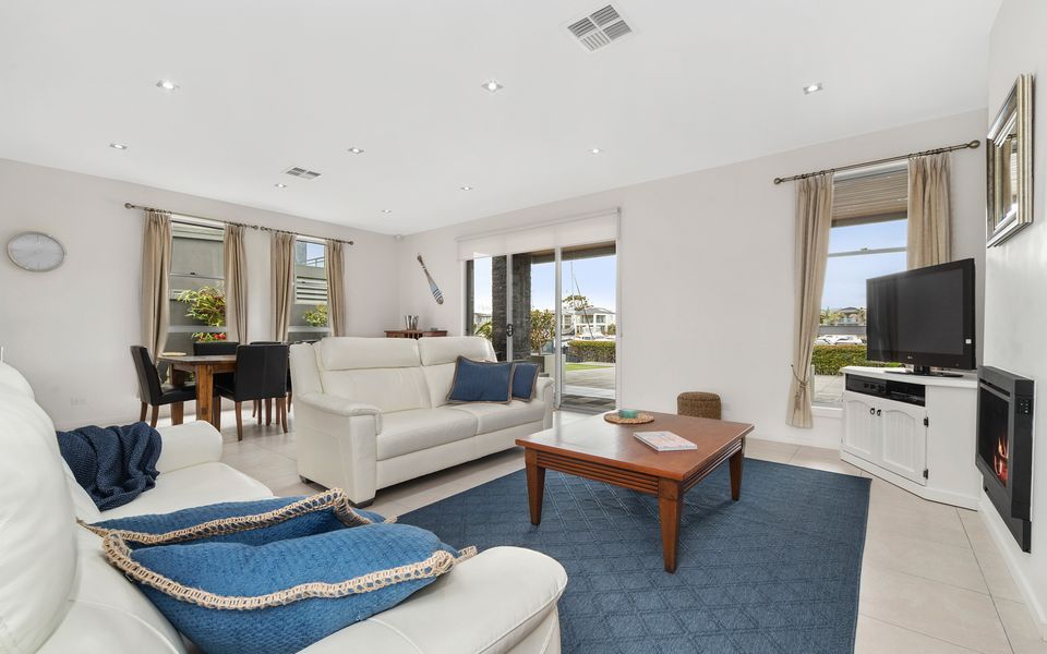 Main family living room with gas fireplace and smart TV