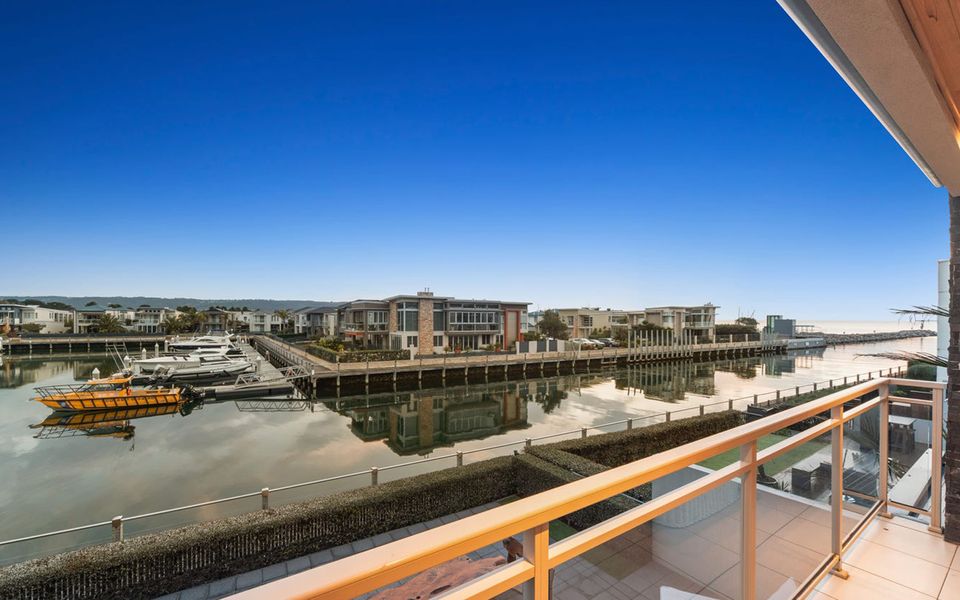 Enjoy watching the boats sail by from the master bedroom balcony