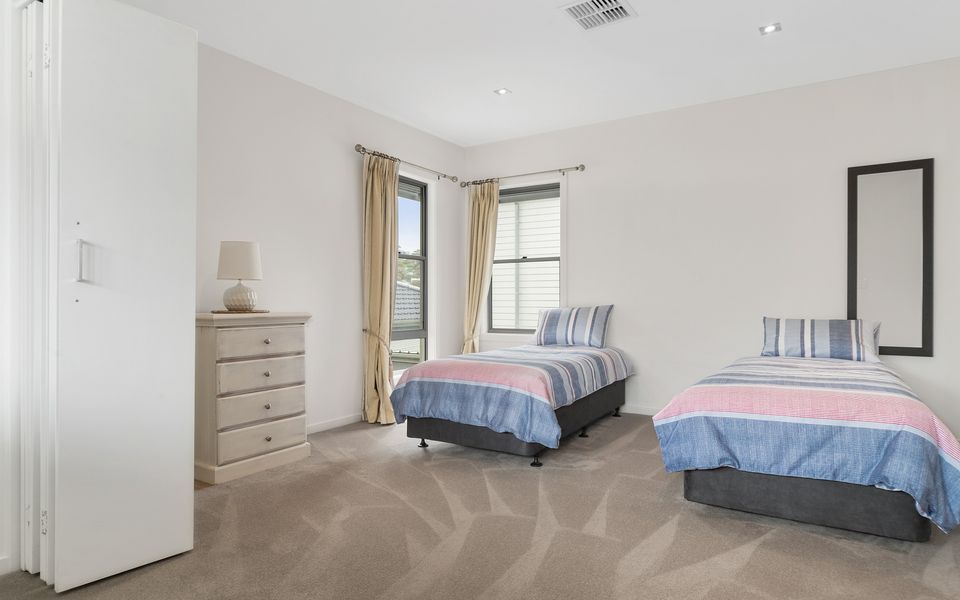 Bedroom three with single beds and trundle bed