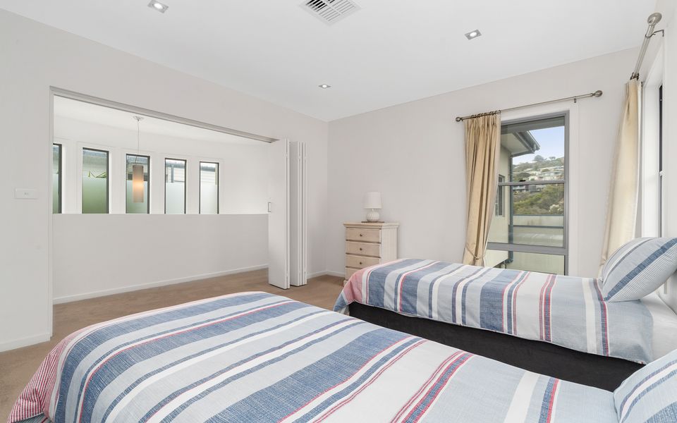 Bedroom three with single beds and a trundle