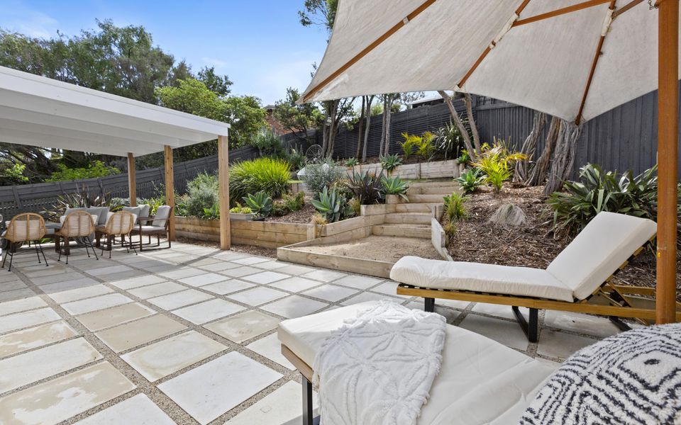 Lanscaped garden and patio with pergola for entertaining.